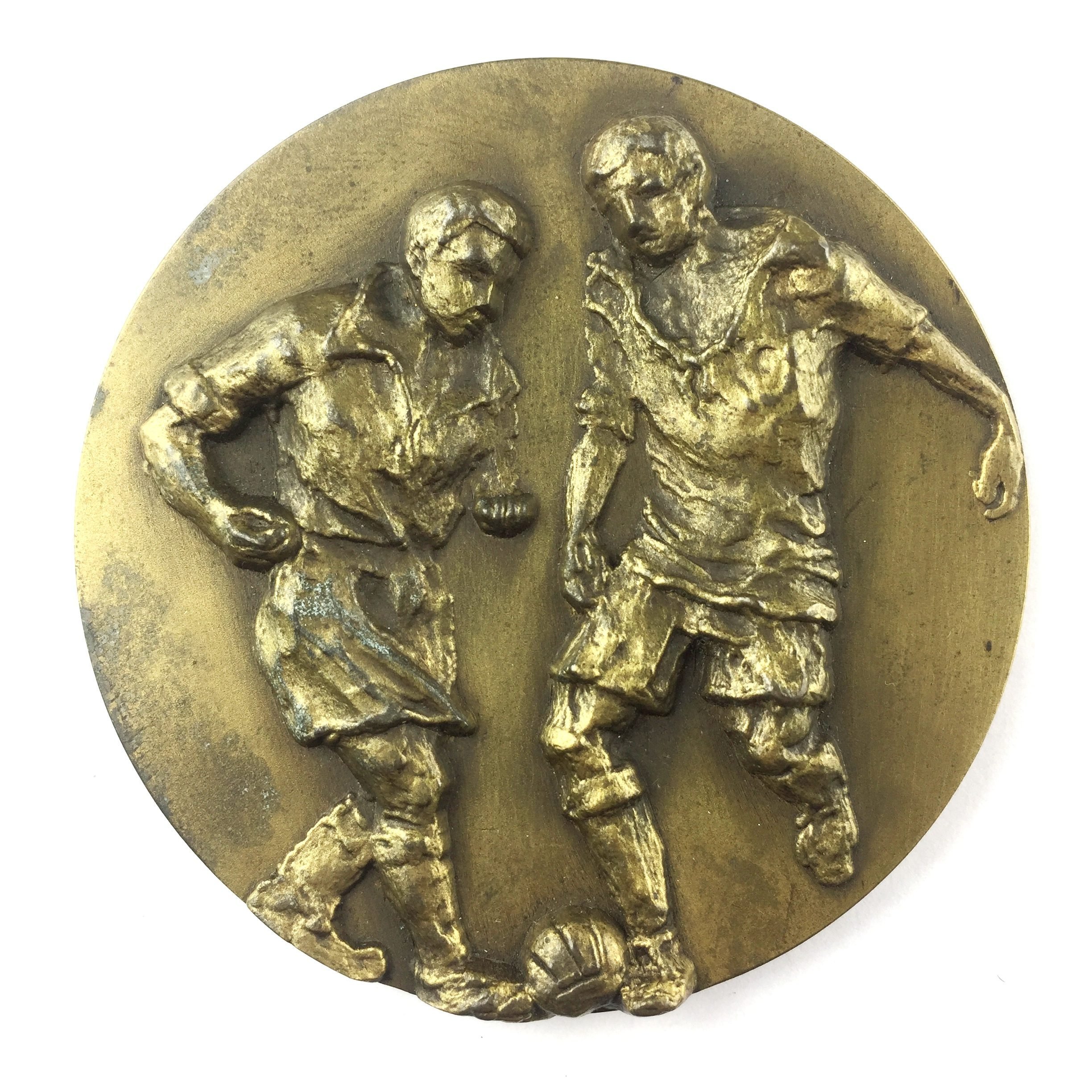 Medalla en metal dorado