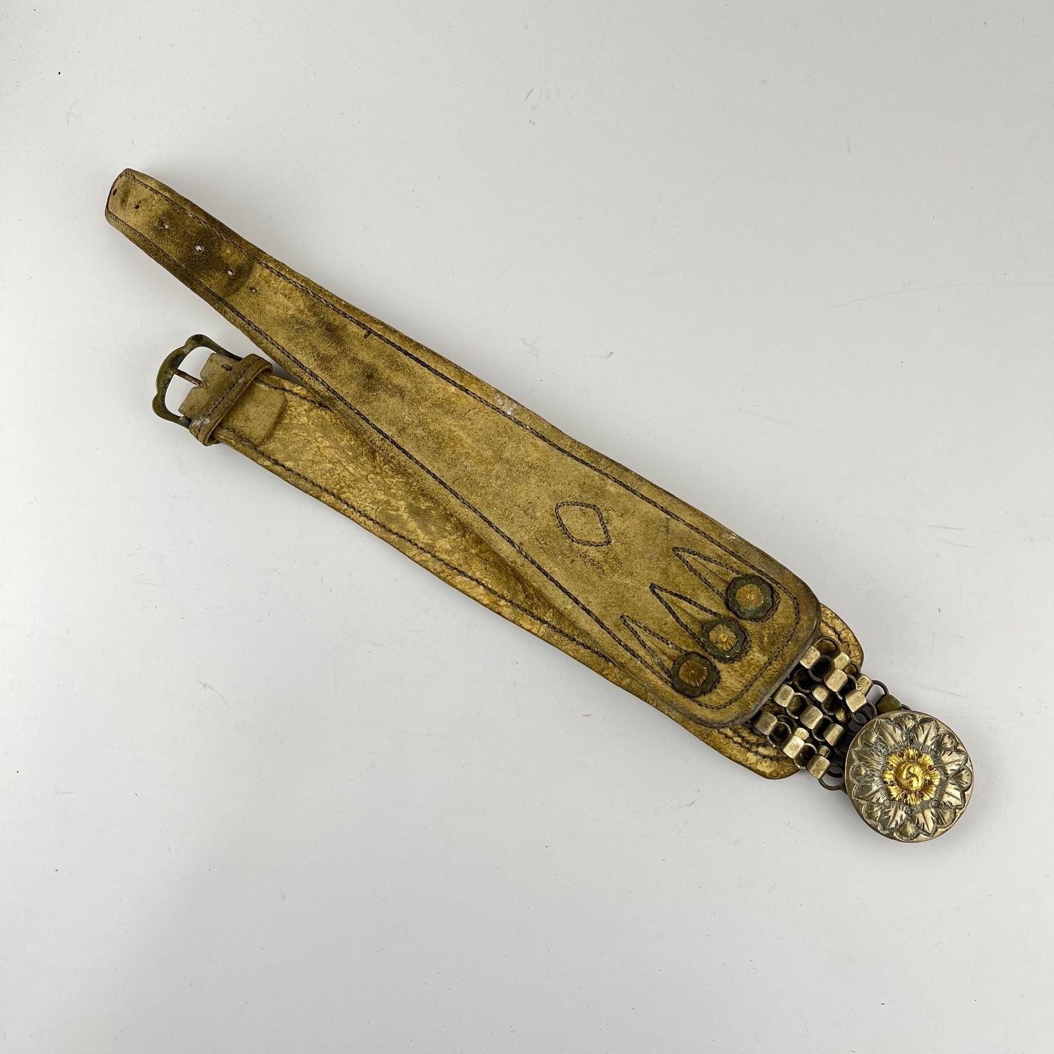 Rastra en plata, oro y cuero