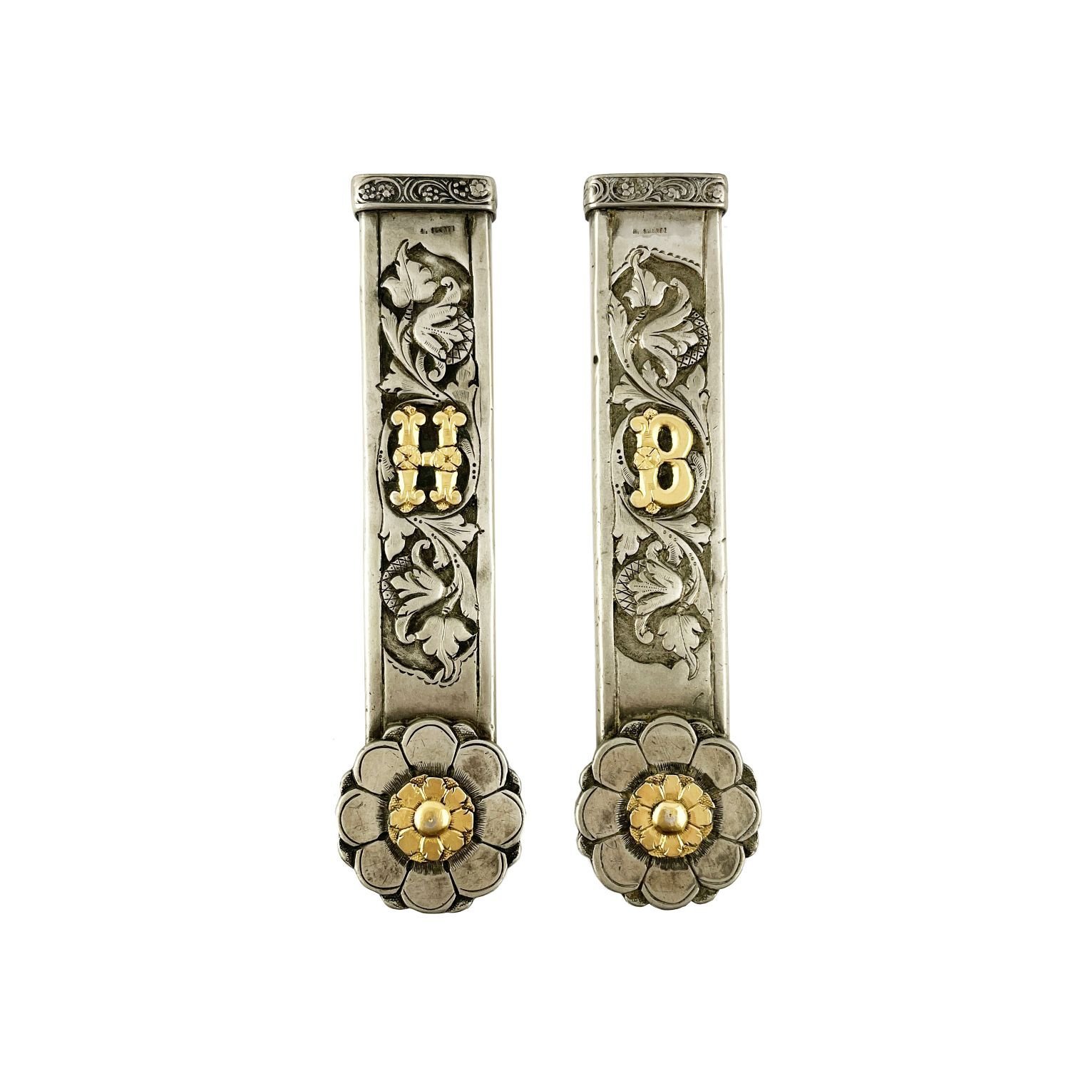 Par de pasadores en plata y oro