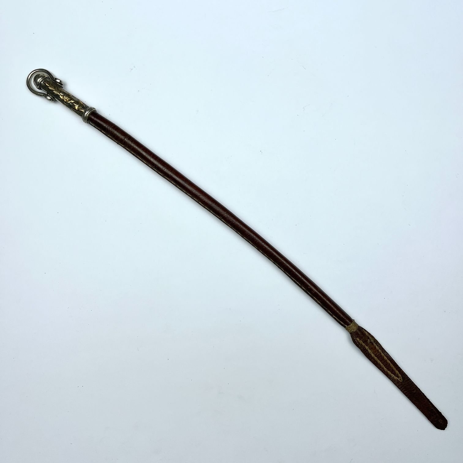 Fusta en cuero, plata y oro