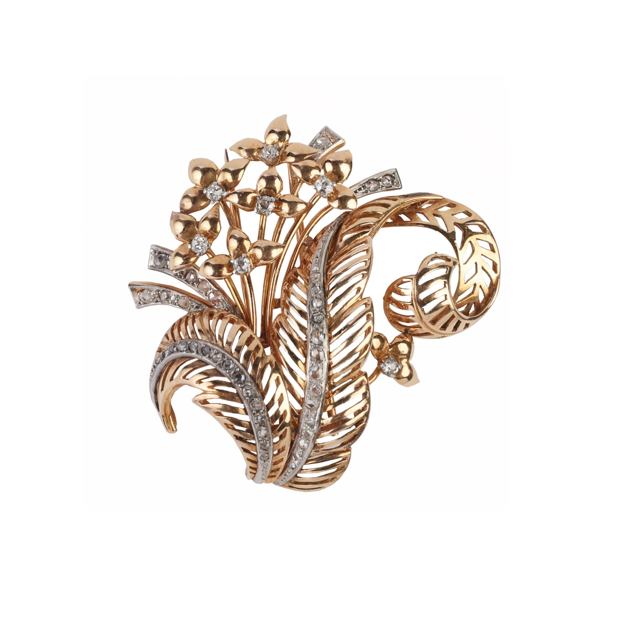 Prendedor oro 18 K, brillantes y diamantes