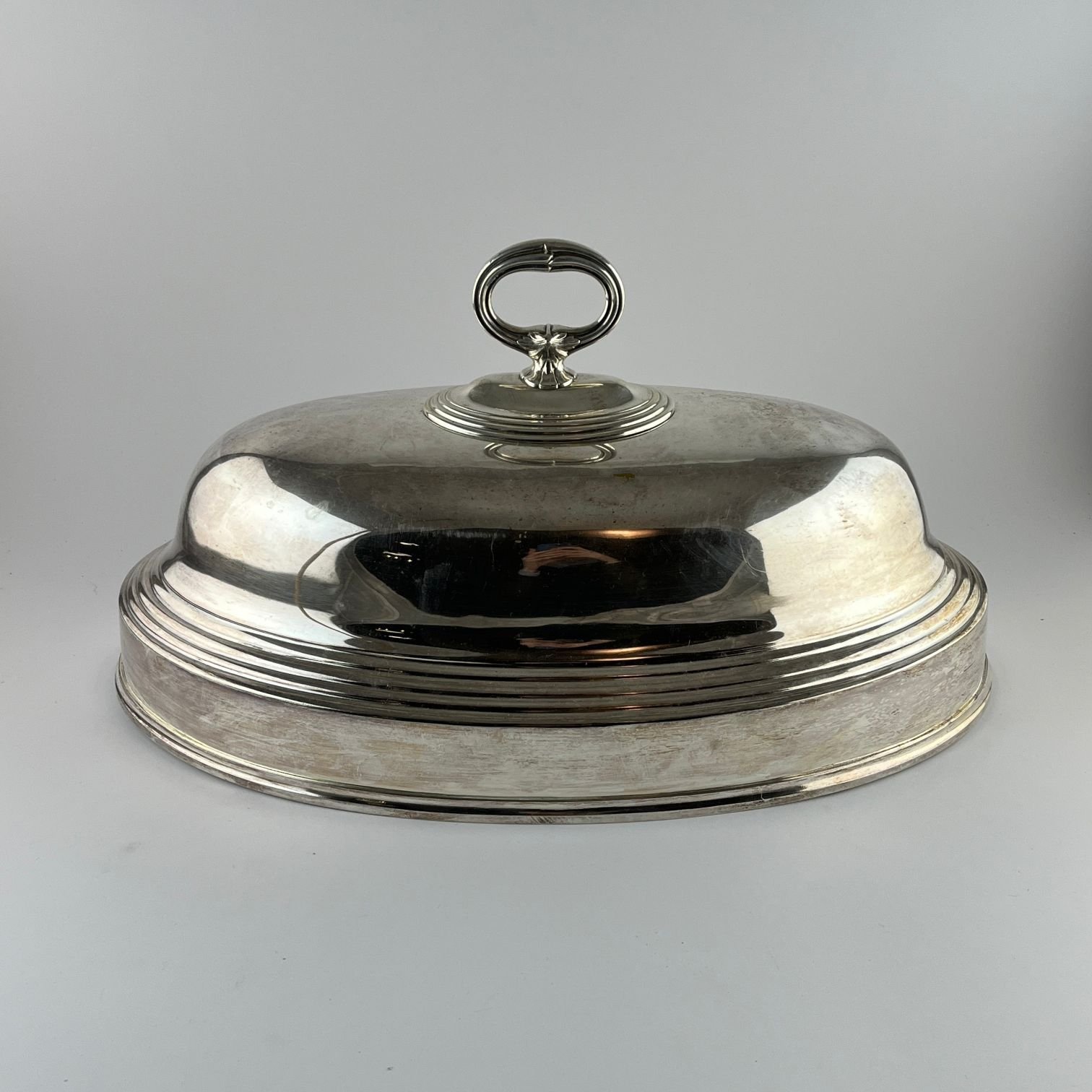 Campana oval en metal plateado