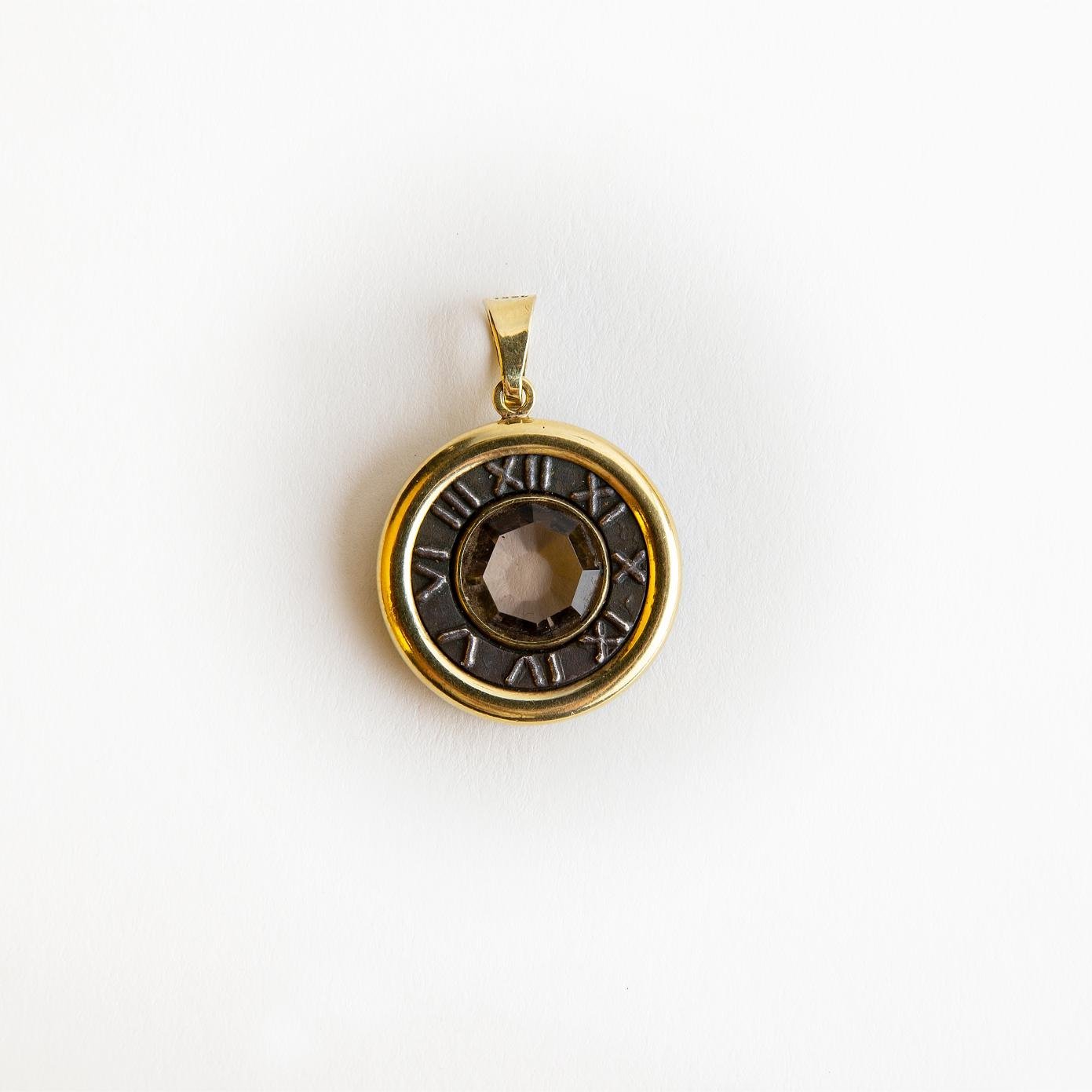 Colgante oro 18 K, metal y topacio