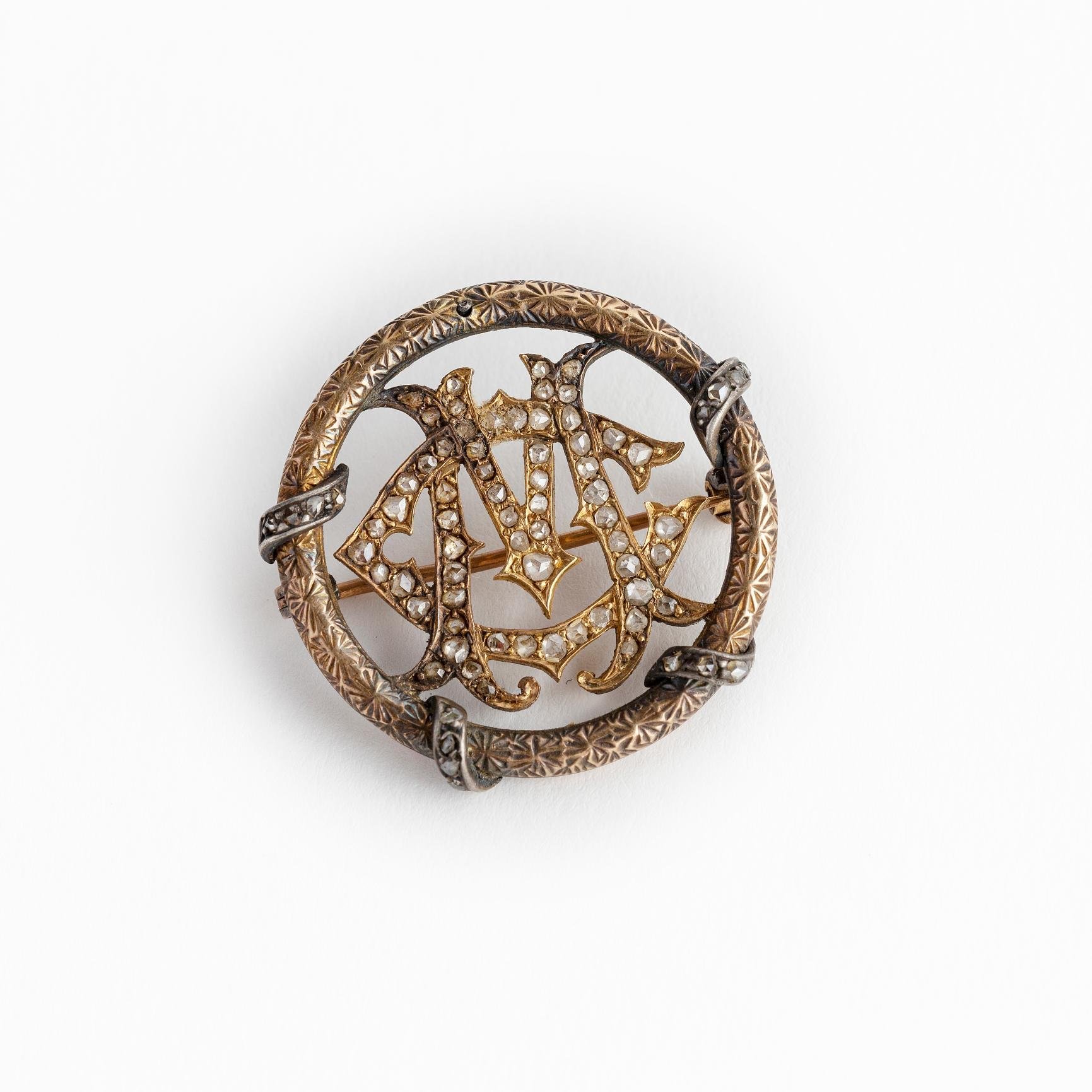 Prendedor oro y diamantes