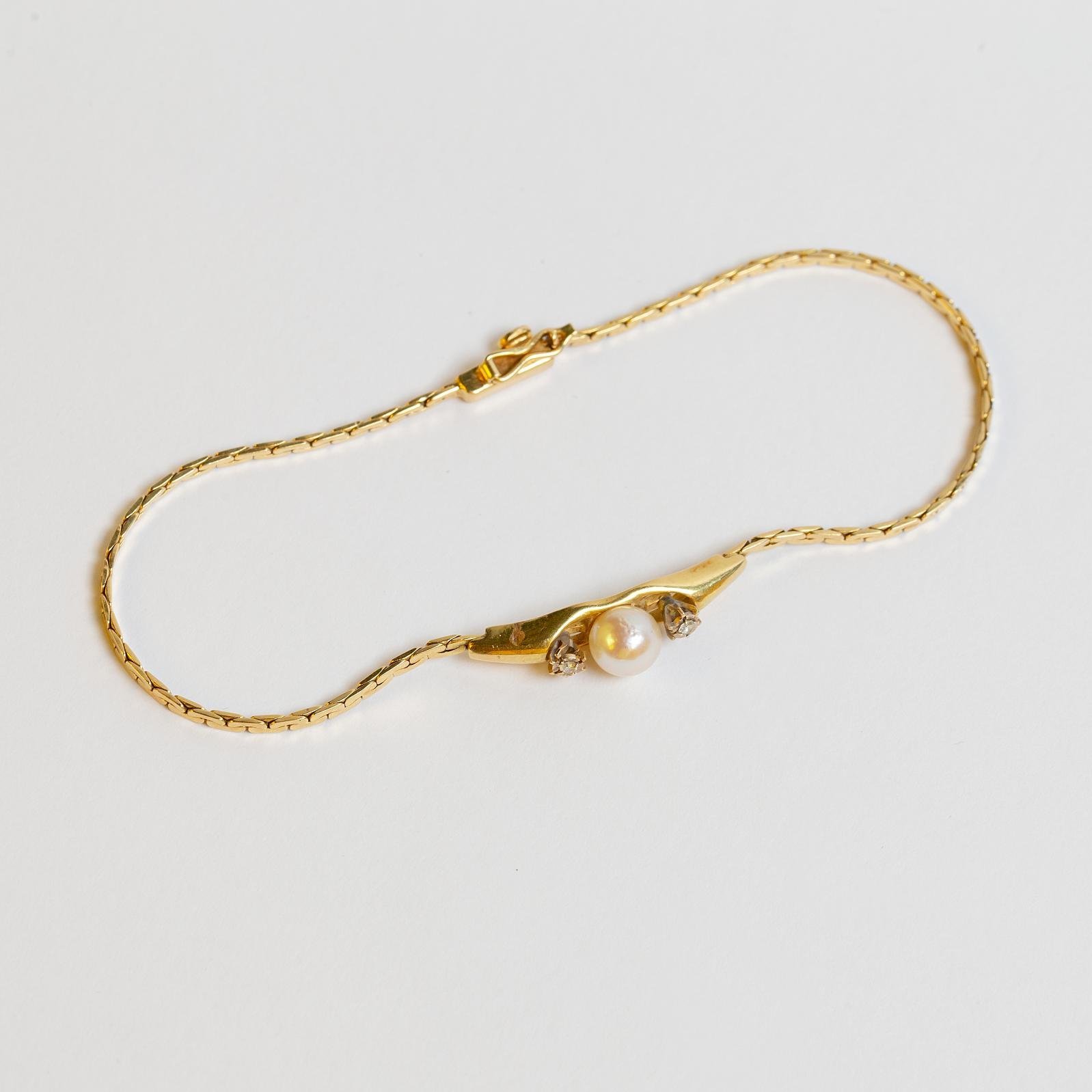 Pulsera oro 18 K, perla y zirconias