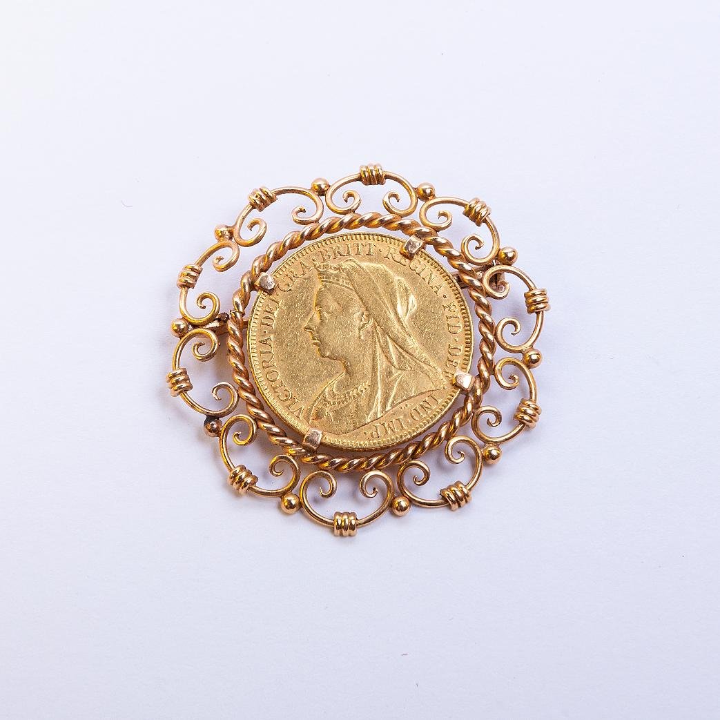 Prendedor oro 18 K y libra
