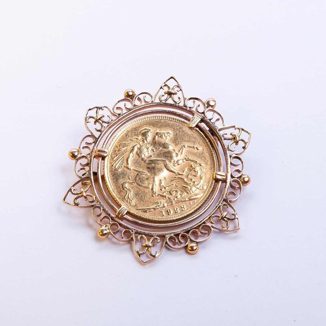 Prendedor oro 18 K y libra