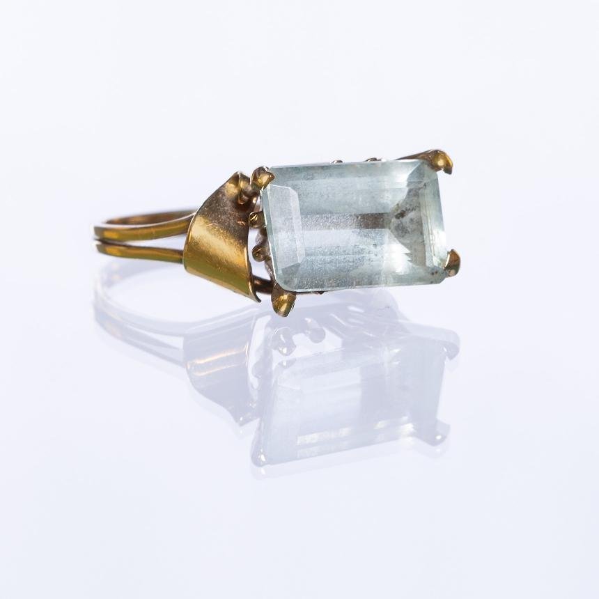 Anillo oro 18 K amarillo y aguamarina