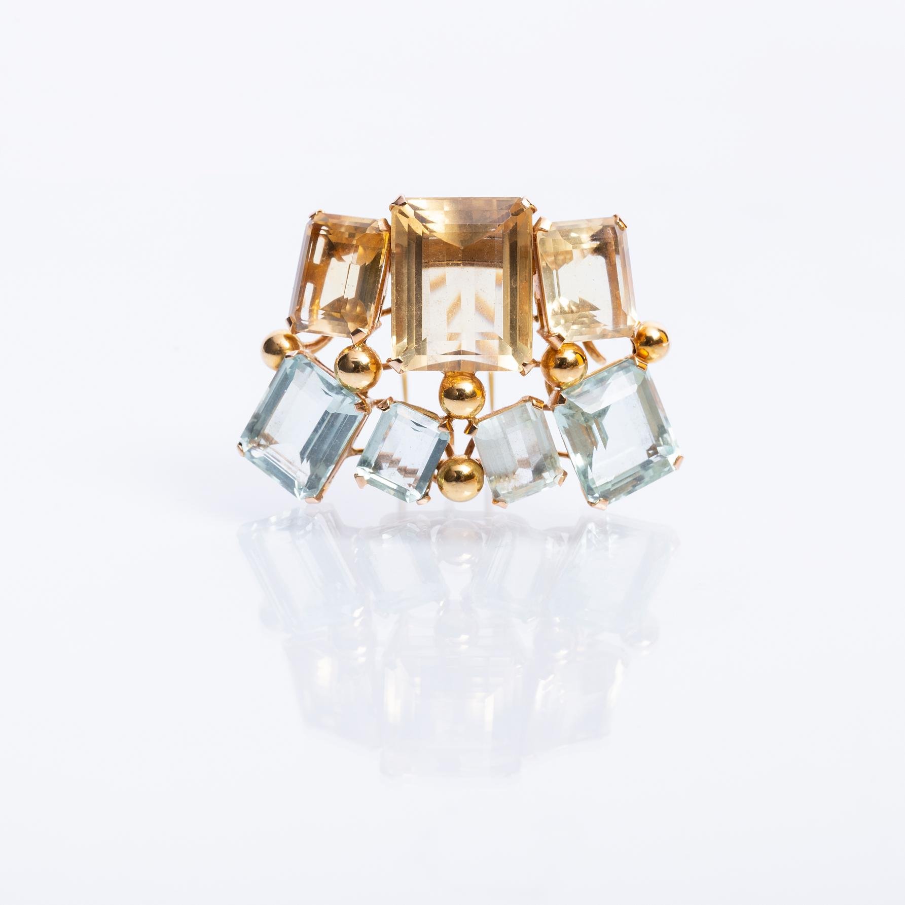 Prendedor oro 18 K amarillo, topacios y aguamarinas