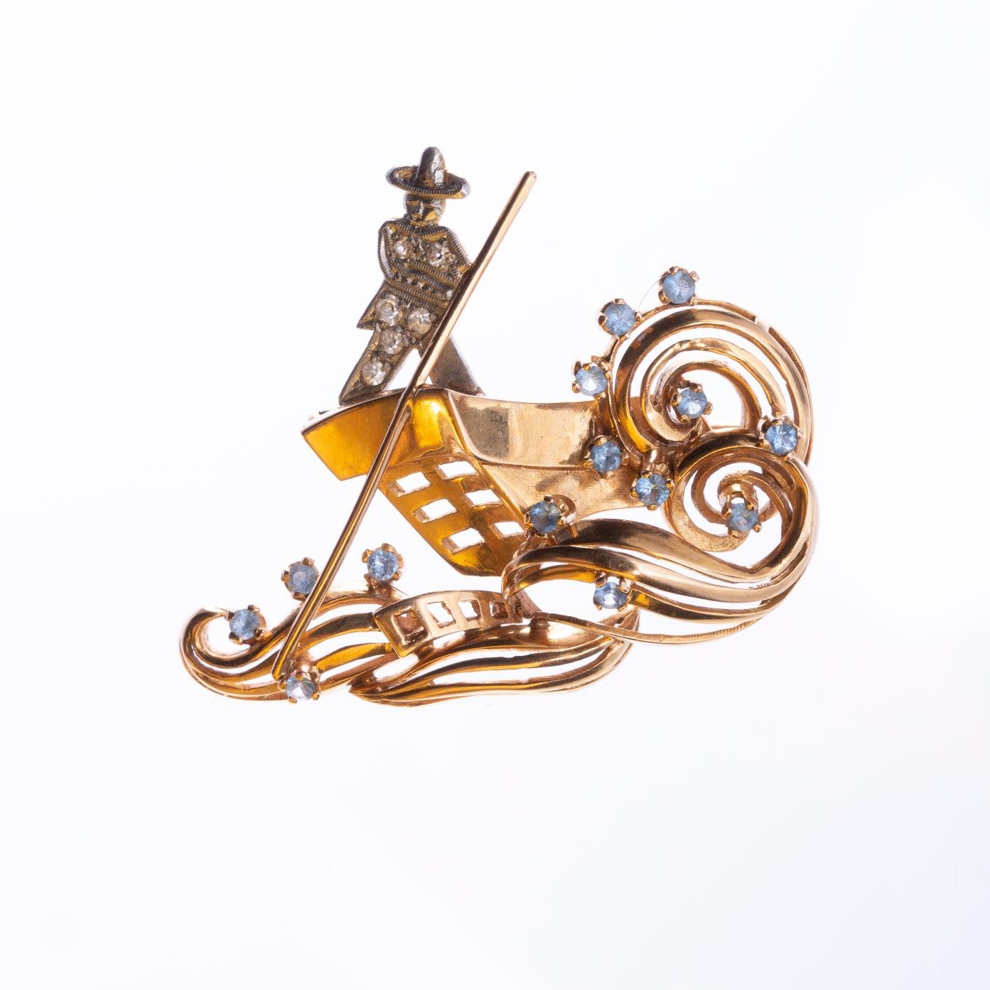 Prendedor oro 18 K amarillo y blanco, diamantes y topacios