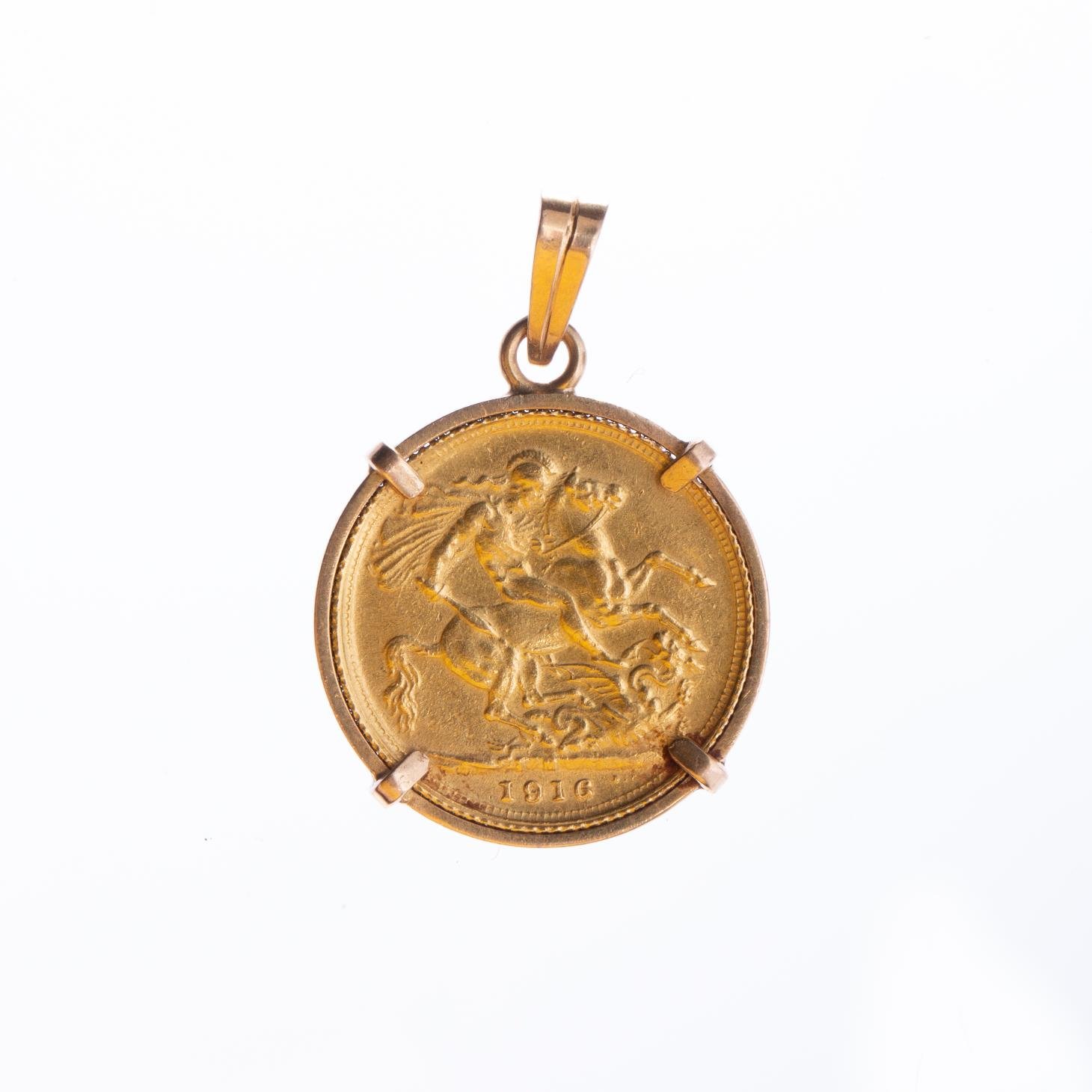 Prendedor oro 18 K y libra