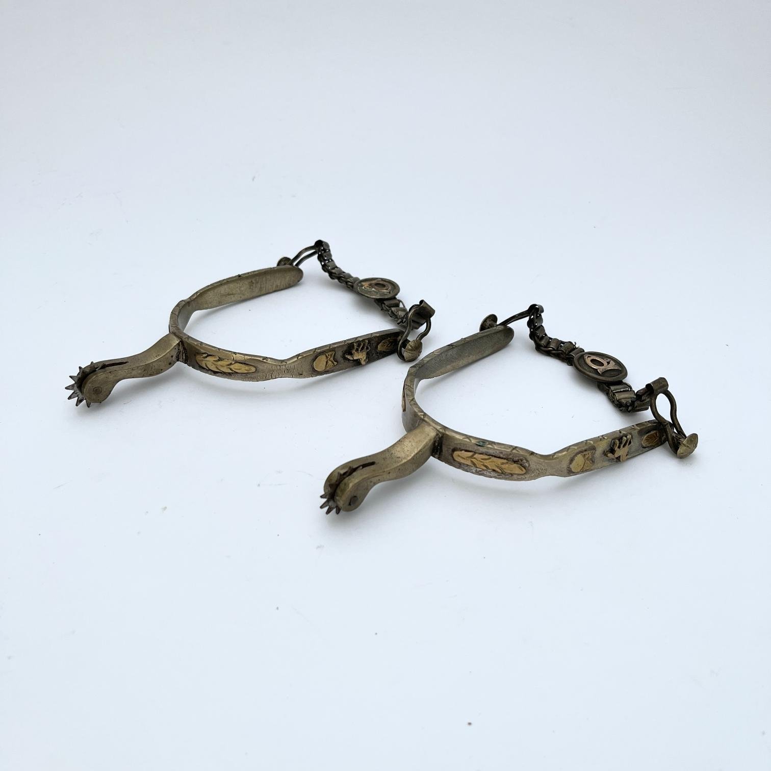 Par de espuelines en plata y oro