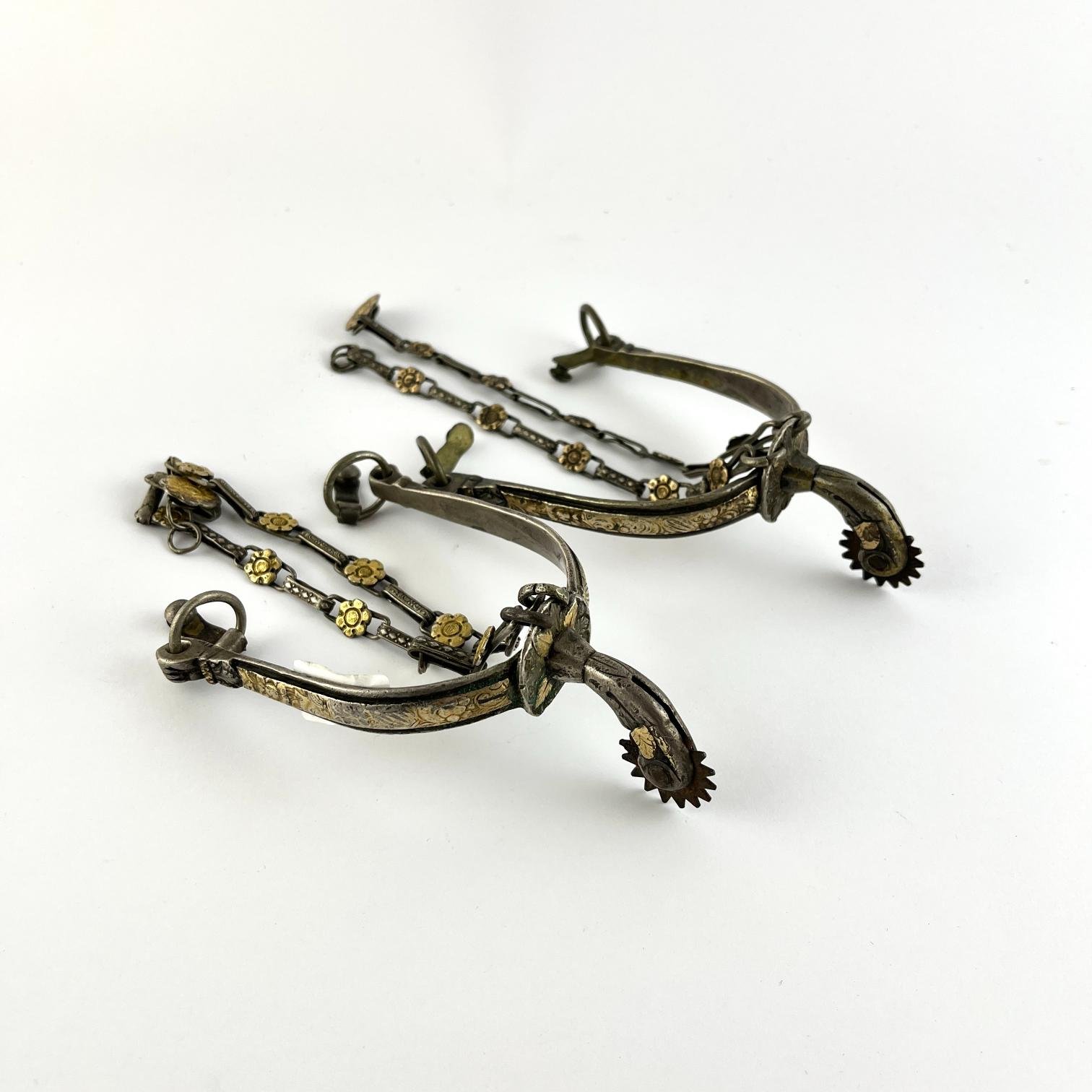 Par de espuelines en plata y oro