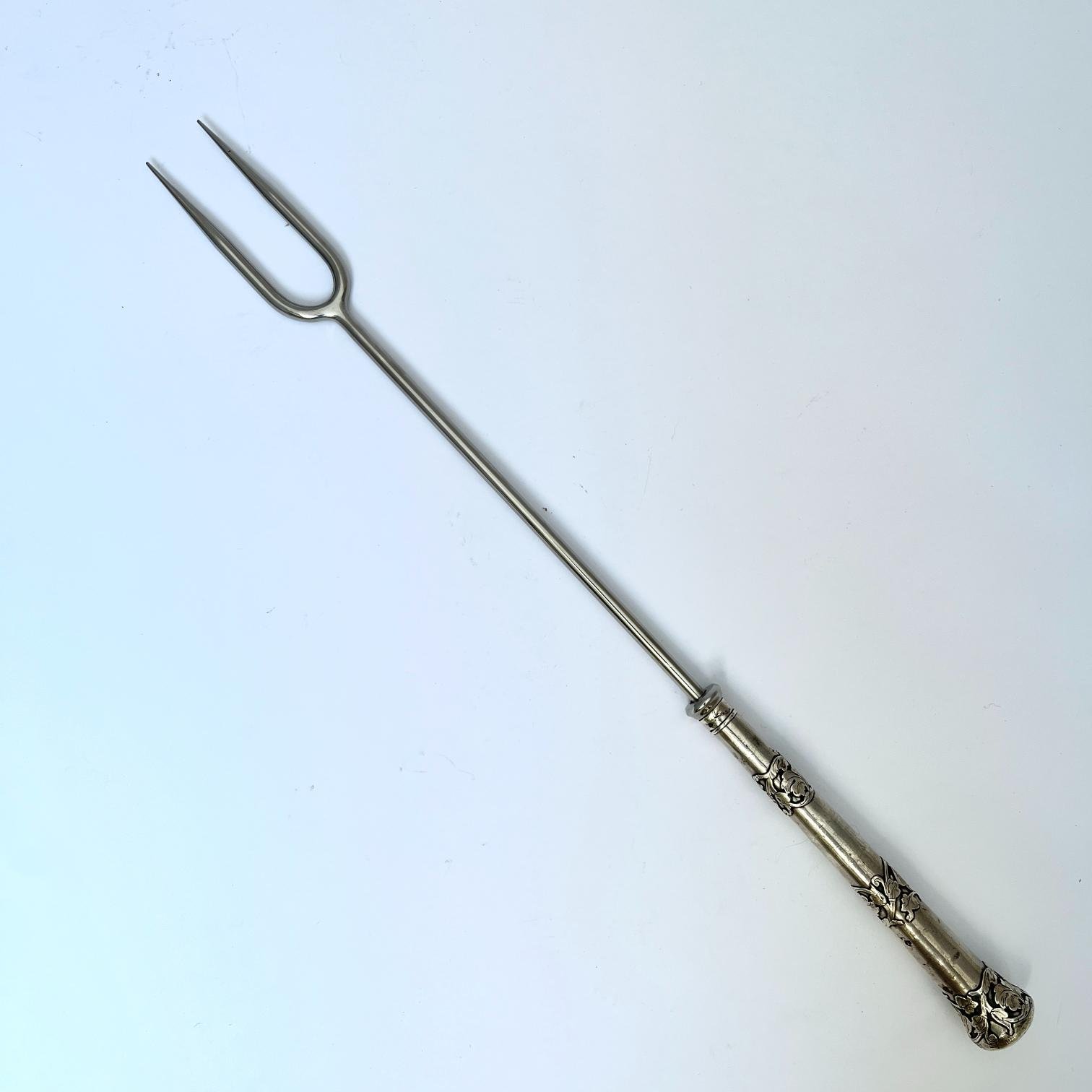 Pincho de asado en acero y plata