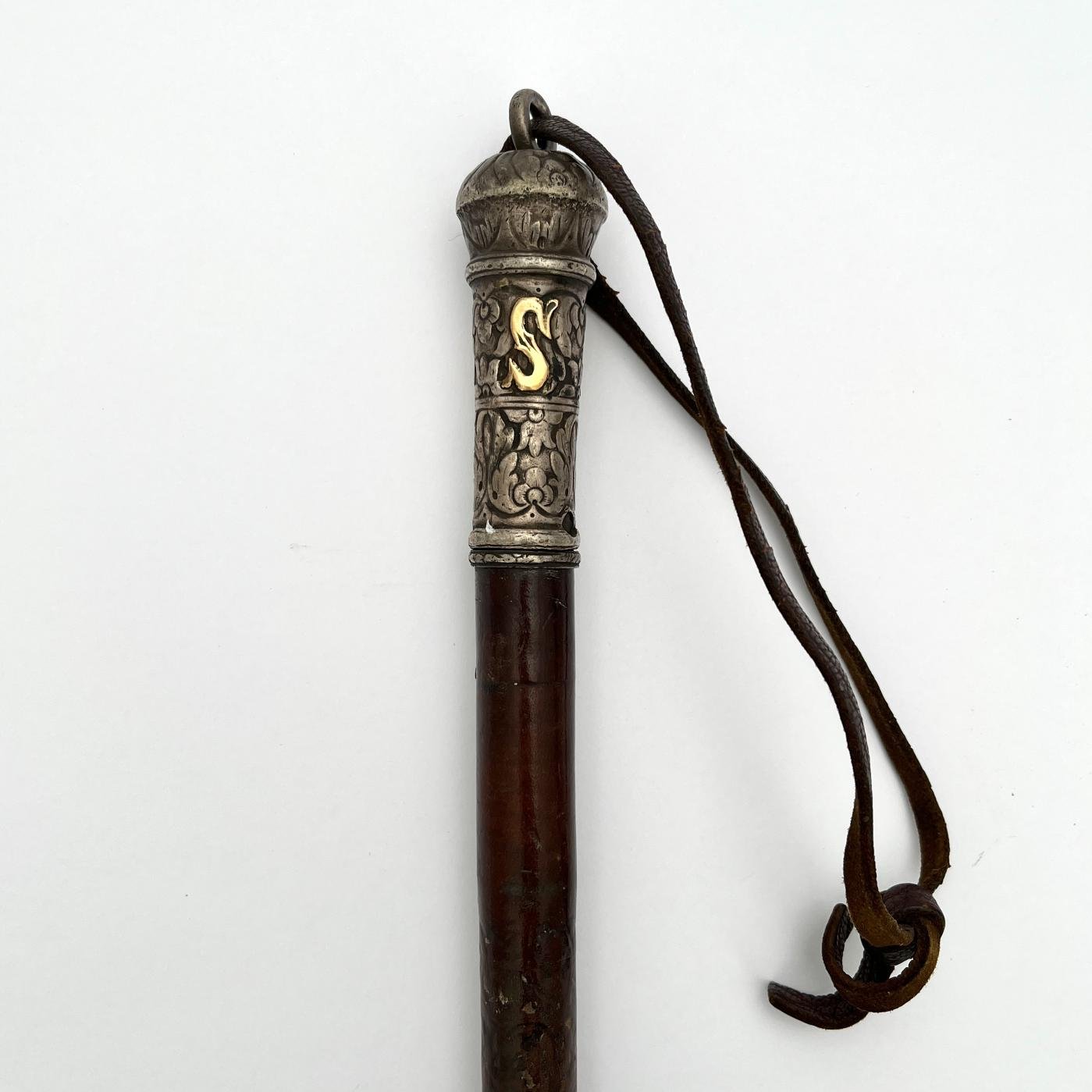 Rebenque en plata y oro