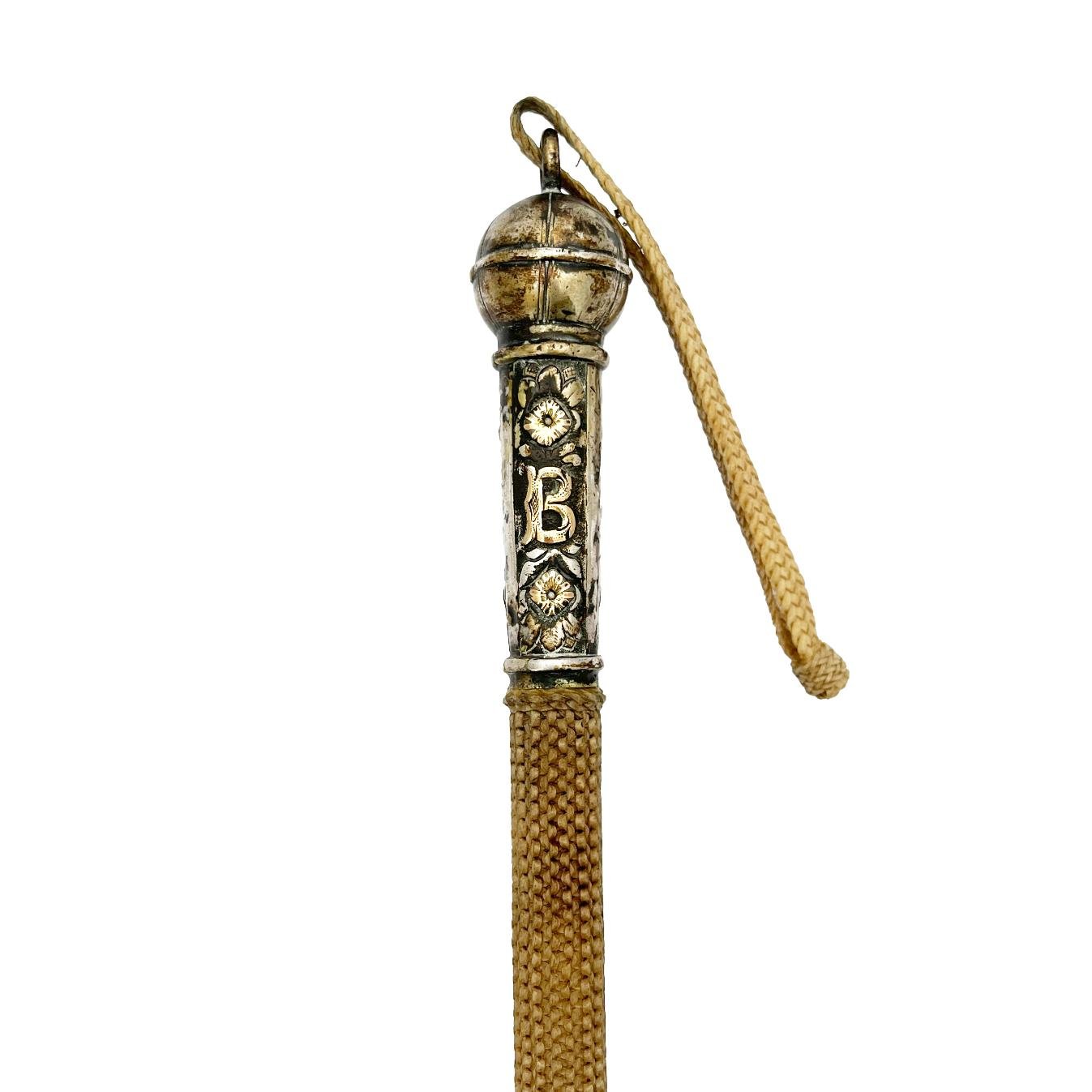 Rebenque en plata y oro