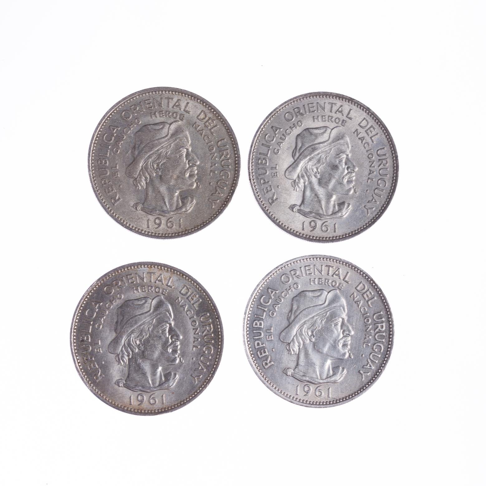 Cuatro monedas en plata