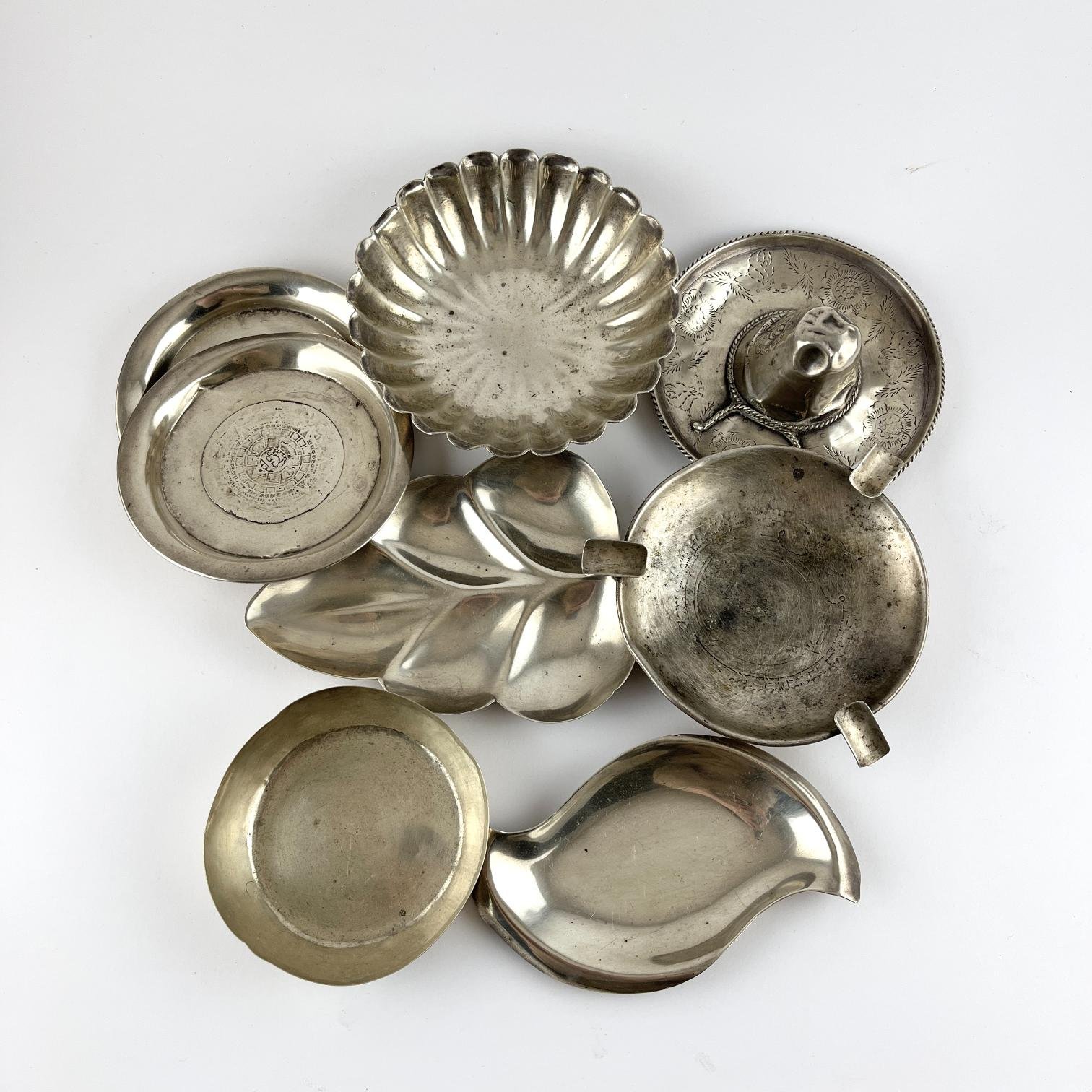 Ocho ceniceros en plata