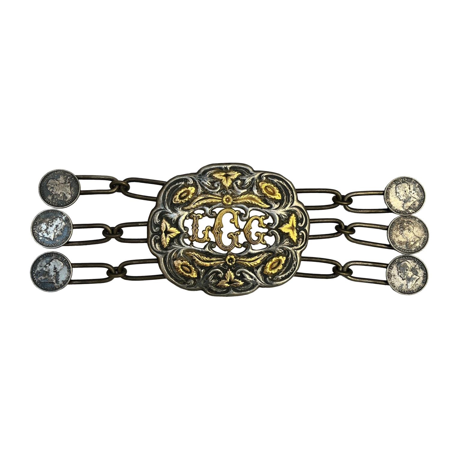 Rastra en plata y oro