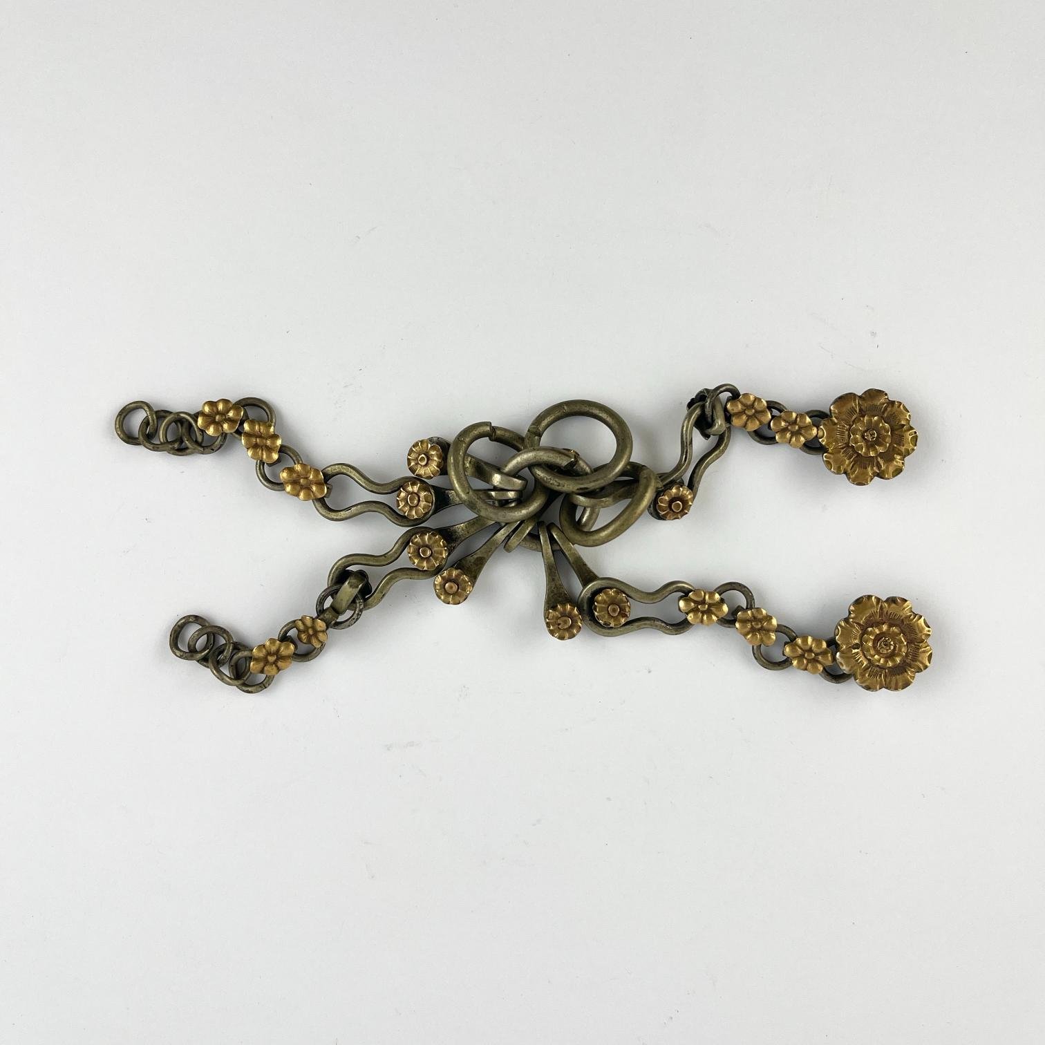 Par de alzaprimas en plata y oro