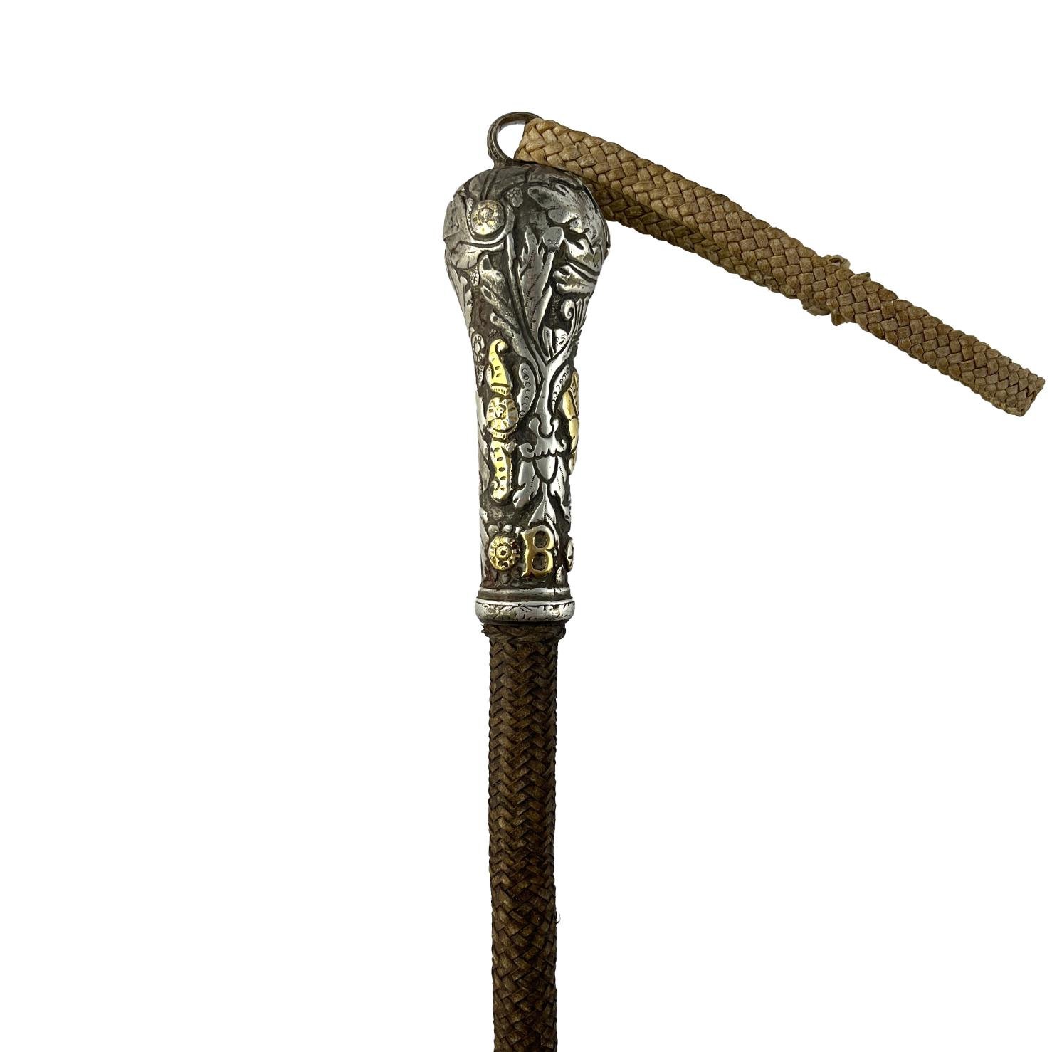 Rebenque en plata y oro